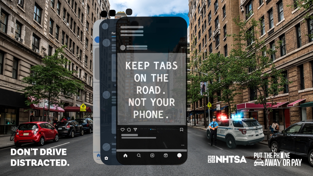 Phone rendering of an instagram post that reads "Keep tabs on the road. Not your phone." in an ad to discourage distracted driving by NHTSA.