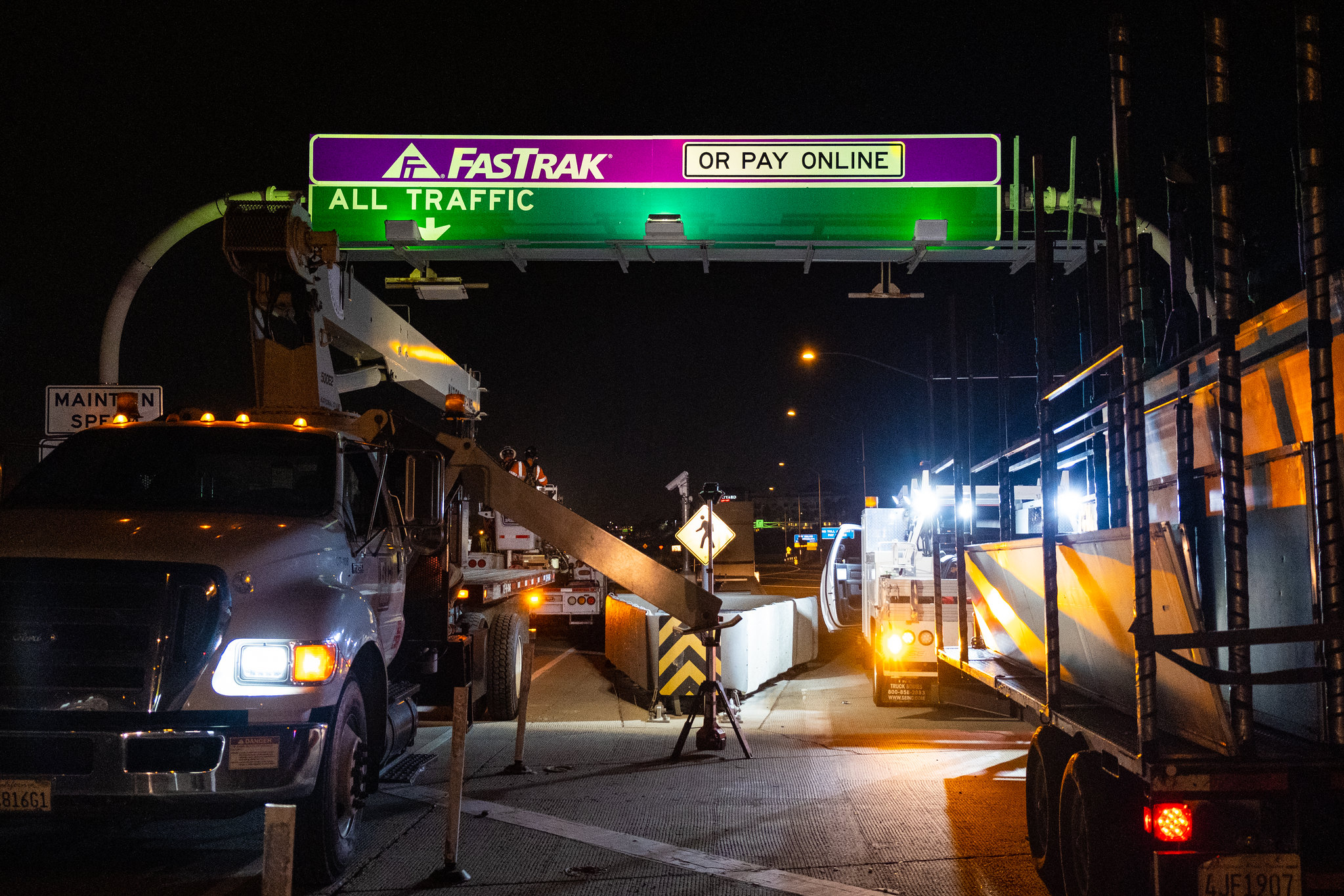 Photo of a purple FasTrak sign installed above the 73 Toll Road 