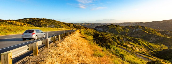 A car driving along the toll roads