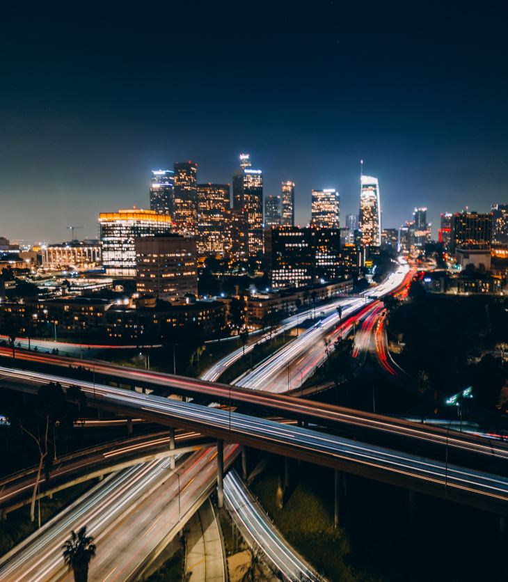 photo of a highway in Los Angeles at night with blurred cars