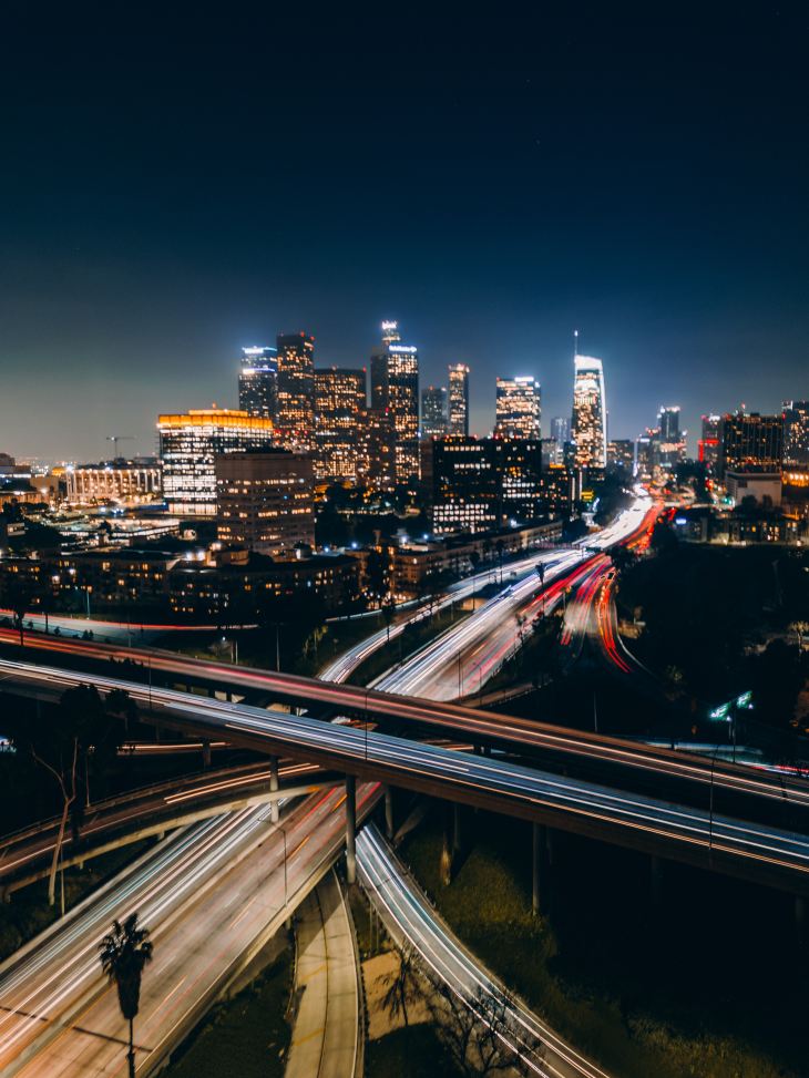 photo of a highway in Los Angeles at night with blurred cars